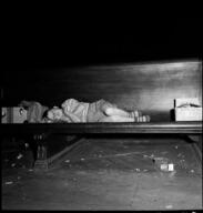 Boy lying down on bench, Union Station, Chicago, May 1948