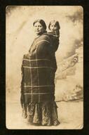 Woman carrying baby on her back, Oklahoma?, between 1900 and 1933