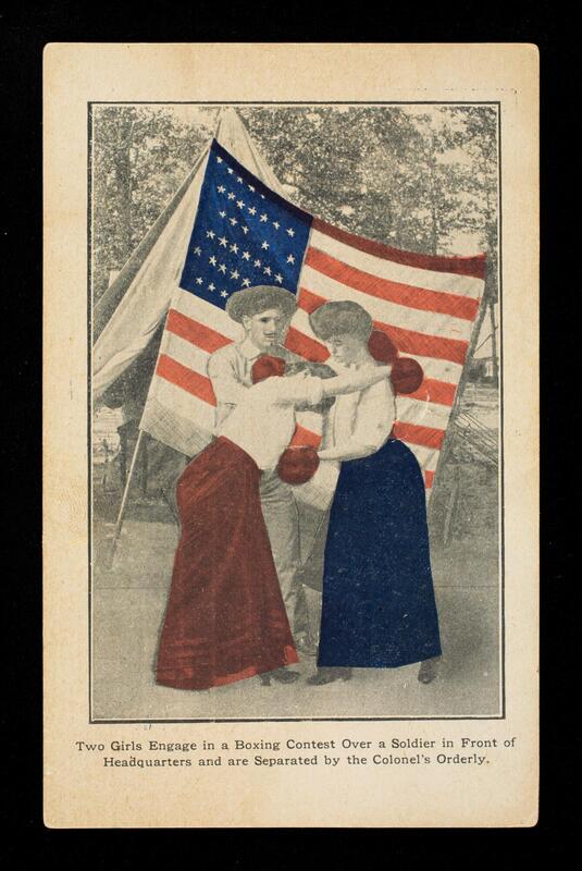 Two girls engage in a boxing contest over a soldier in front of headquarters and are separated by the Colonel's Orderly