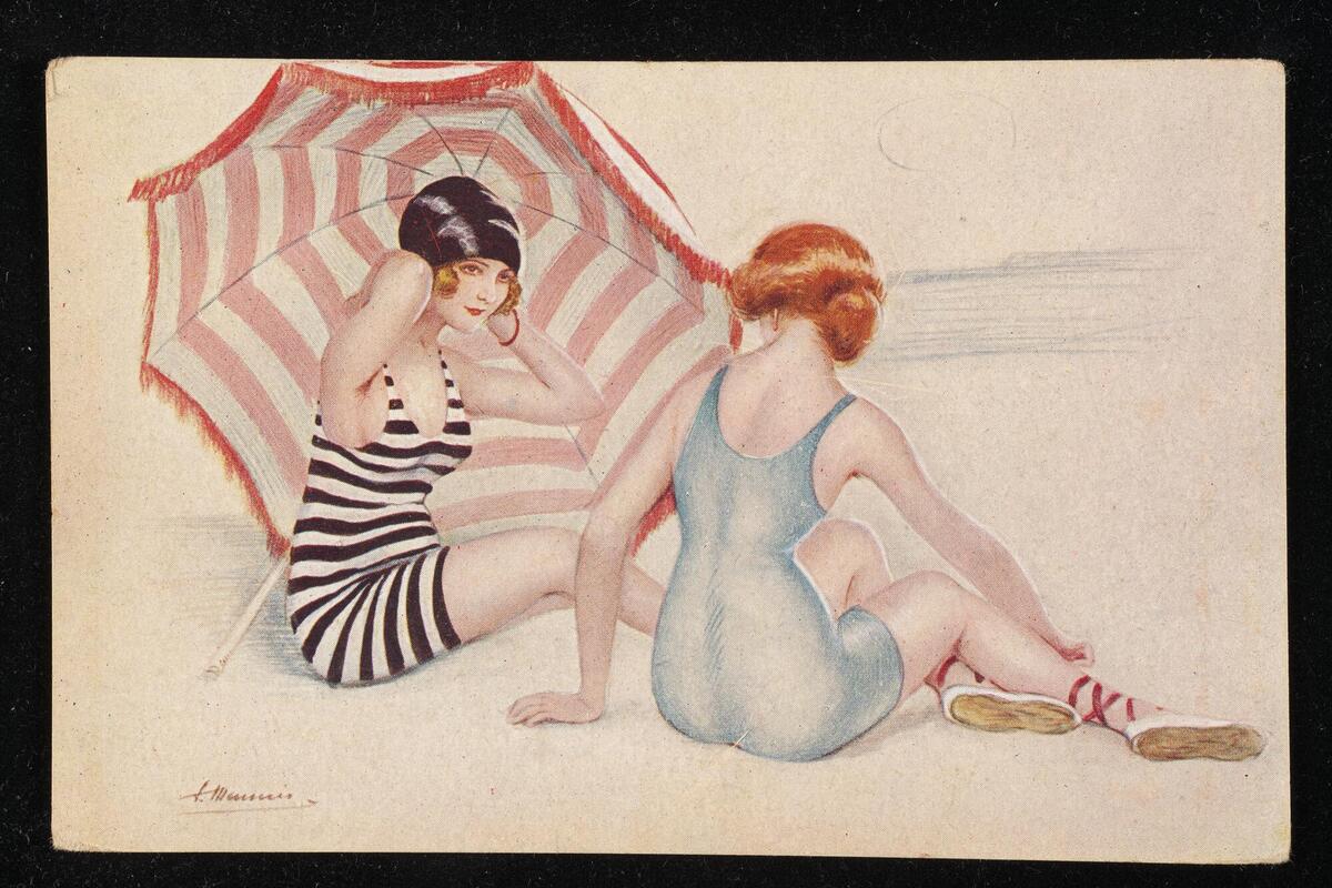 Two women sitting on the beach